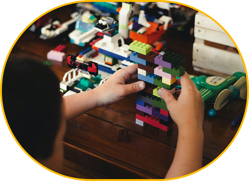 A person playing with blocks on the table